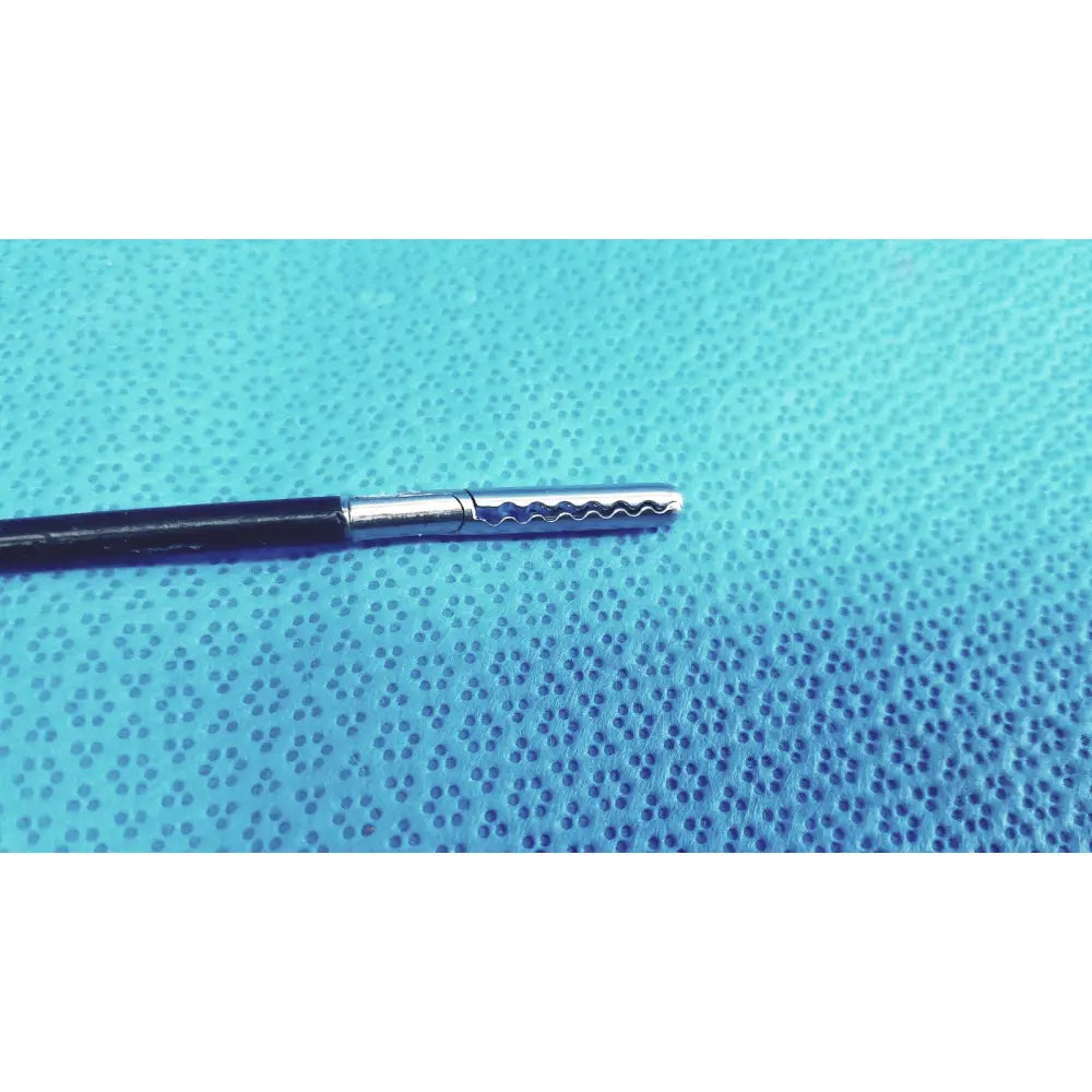 Black-handled stryker stainless steel laparoscopiic clamp with wavy-edged silver tip for surgical use