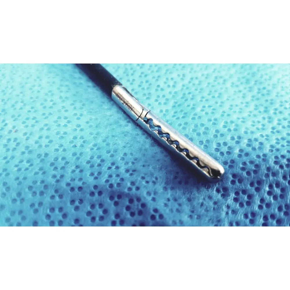A sleek stryker stainless steel laparoscopiic clamp with a black handle and wavy serrated silver shaft