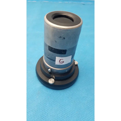 Silver and black cylindrical microscope objective lens with matte finish mounted on circular base of stryker strykecam 2 in-light camera