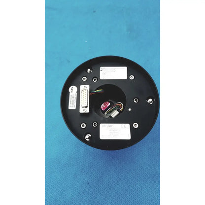 Black circular back side of stryker strykecam 2 in- light camera with central opening wires connectors and silver screws