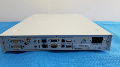 White metal stryker suite stream hd codec device with multiple ports and barcode label on the back side