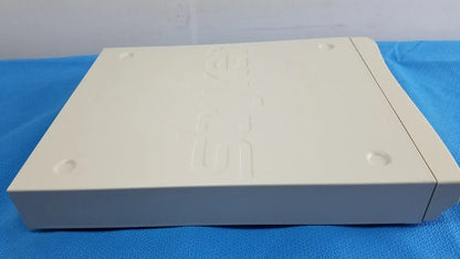 Cream-colored plastic playstation 2 console with embossed logo and circular indentations for Stryker Suite Stream HD Codec