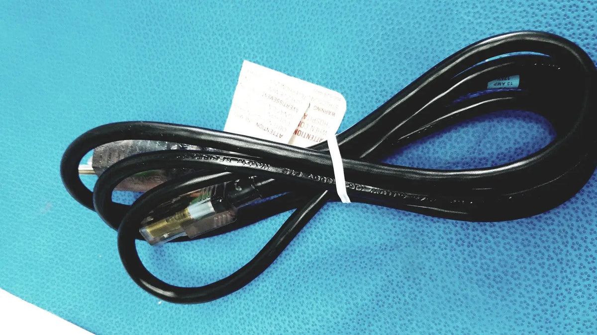 Black coiled power cord with two prong plug and white tag for stryker suite stream hd codec 0678001200