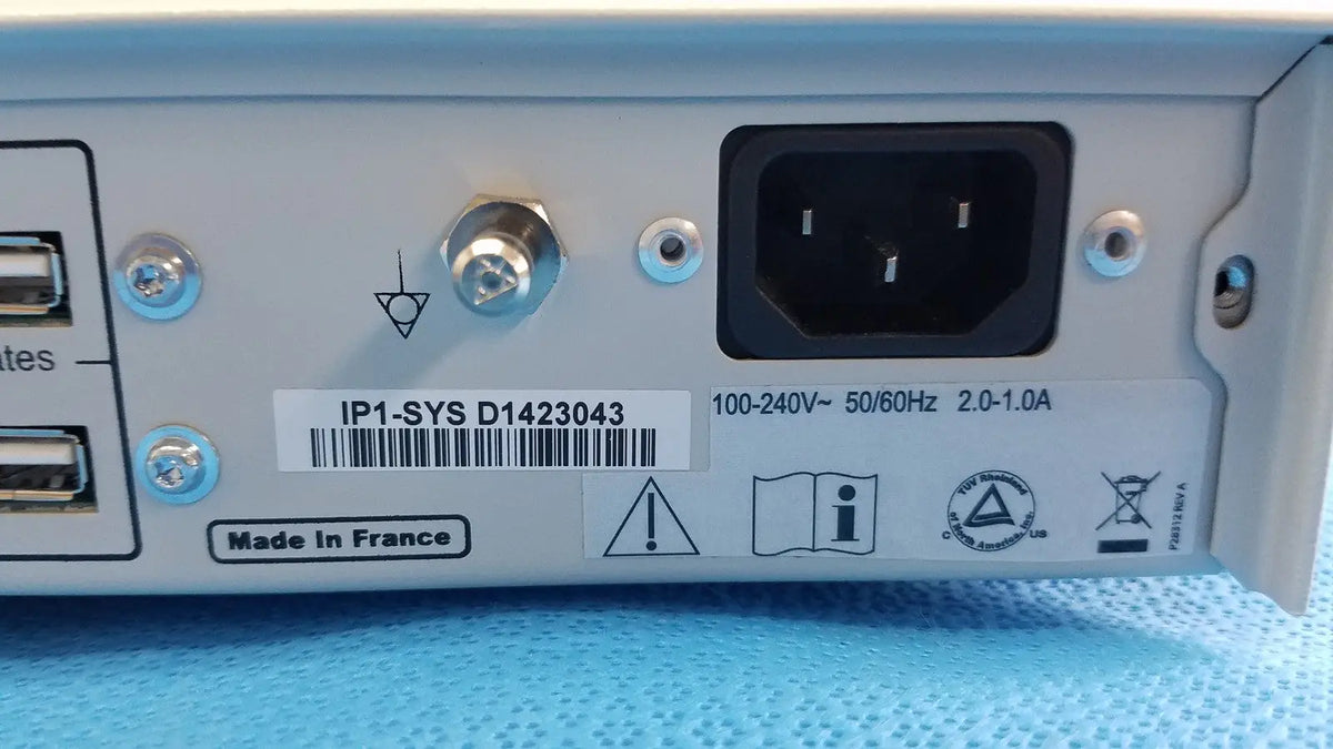 Back side of gray metal stryker suite stream hd codec with black power port and silver screws made in France