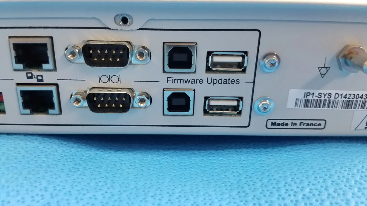 Light gray industrial network device with ethernet rs-232 and usb ports on the back for stryker suite stream hd codec