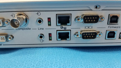 Light blue stryker suite stream hd codec 0678001200 with multiple ports including composite, line, ethernet, and serial connectors