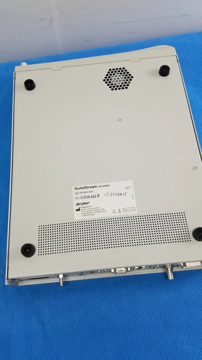 White stryker suite stream hd codec 0678001200 medical imaging device with black rubber feet and ventilation grilles visible from back