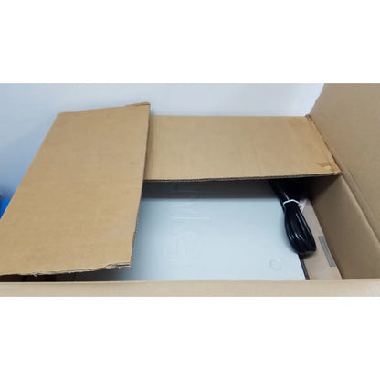 A sleek light gray stryker suite stream hd codec device with minimalist design inside an open cardboard box