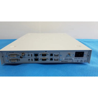 White metal stryker suite stream hd codec device with multiple ports and barcode label on the back side