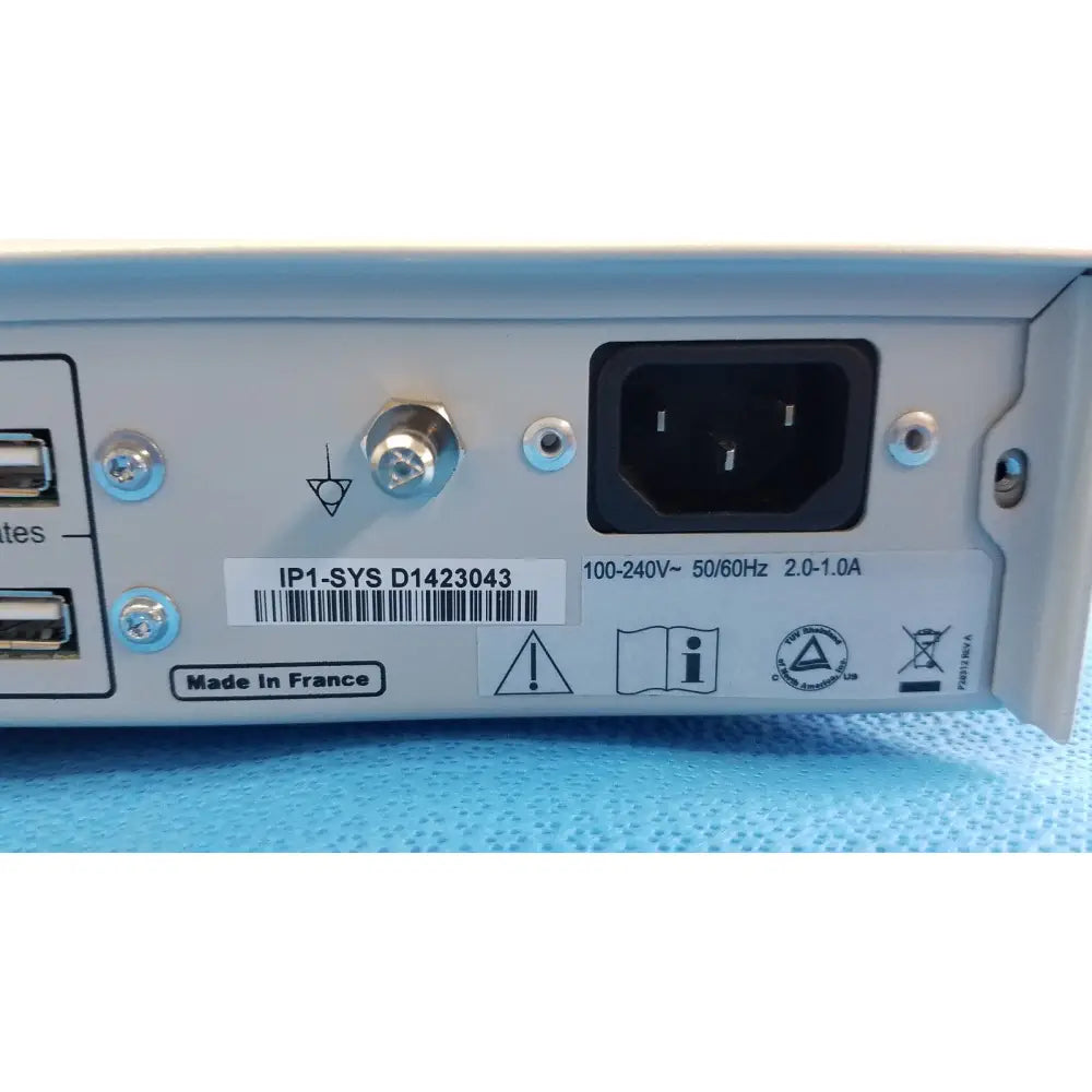 Back side of gray metal stryker suite stream hd codec with black power port and silver screws made in France