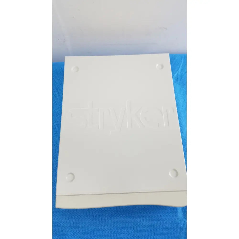 White rectangular emykorr brand box with embossed logo and indentations for stryker suite stream hd codec 0678001200