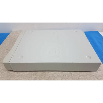 White plastic sony playstation 1 console with embossed logo and rounded edges shown in stryker suitestream hd medical video integration system