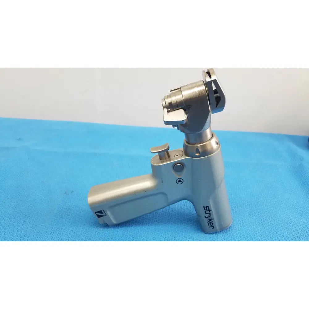 Stryker system 7 sagittal saw handpiece 7208-000-000 with silver metallic ergonomic handle and articulated head for reuse medical orthopedic instruments