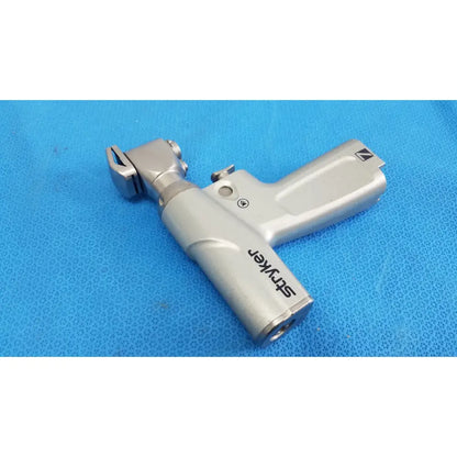 Silver stryker system 7 sagittal saw handpiece with textured grip and ergonomic design for reuse medical orthopedic instruments