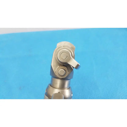 Silver metallic universal joint with polished finish and bolted connections for stryker system 7 sagittal saw handpiece reuse medical orthopedic instruments