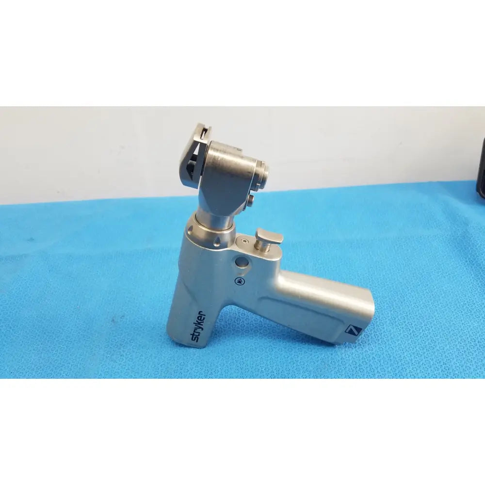 Stryker system 7 sagittal saw handpiece with metallic ergonomic handle and articulated head for reuse medical orthopedic instruments
