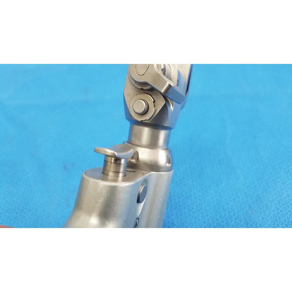 Stryker System 7 sagittal saw handpiece in silver metallic with articulated joints and textured grip for orthopedic instruments reuse medical