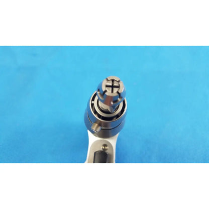 Silver-colored Stryker System 8 sternum saw drill bit with cross-shaped drive tip for reuse medical orthopedic instruments