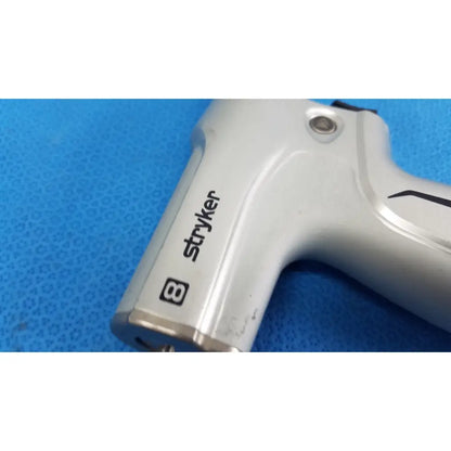 Silver stryker system 8 sternum saw 8207-000-000 with black branding and metallic finish for reuse medical orthopedic instruments