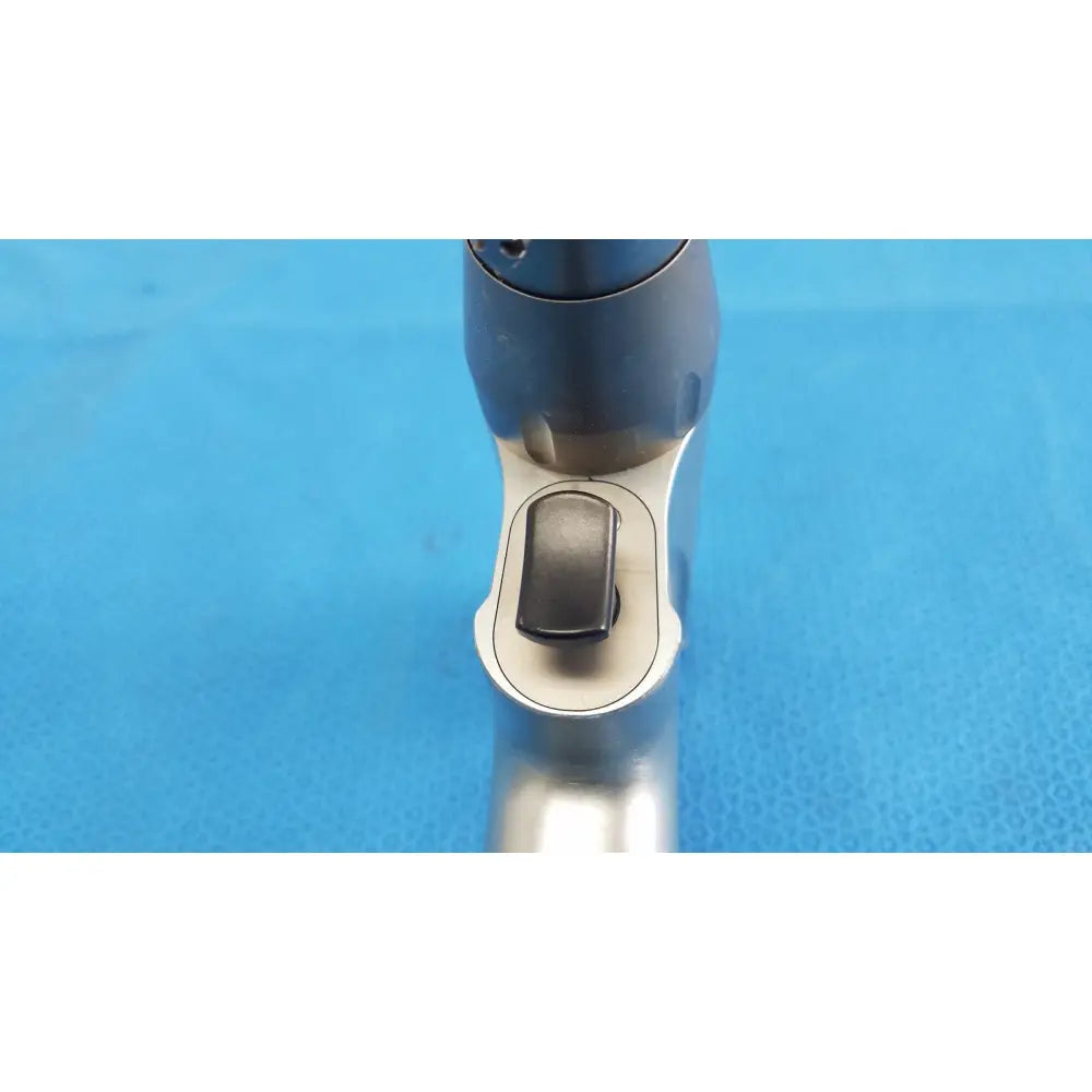 Silver and black ergonomic pistol grip with textured finish for Stryker system 8 sternum saw reusable medical orthopedic instruments