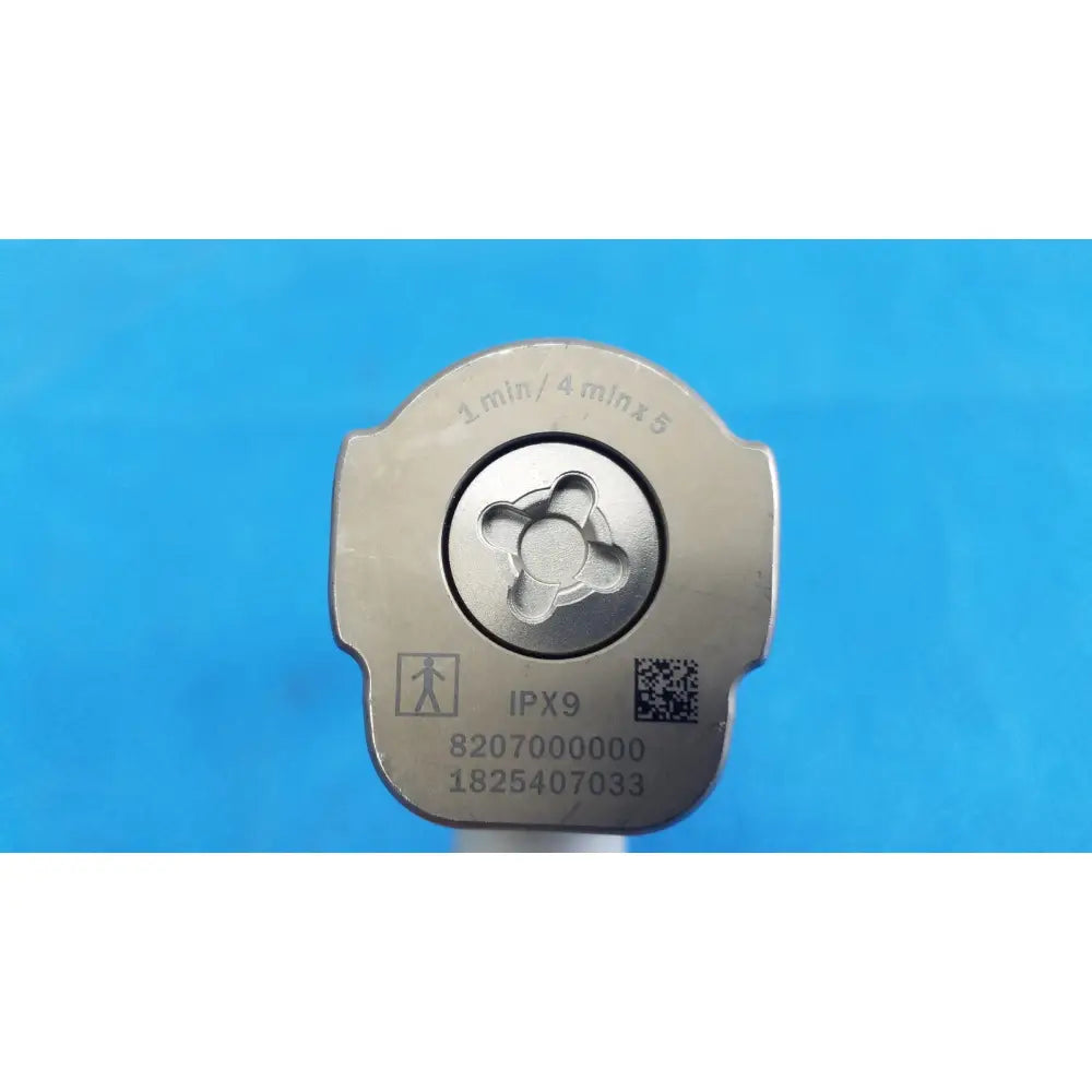 Silver metallic tool head with four-pronged star center and engraved markings on stryker system 8 sternum saw for reuse medical orthopedic instruments