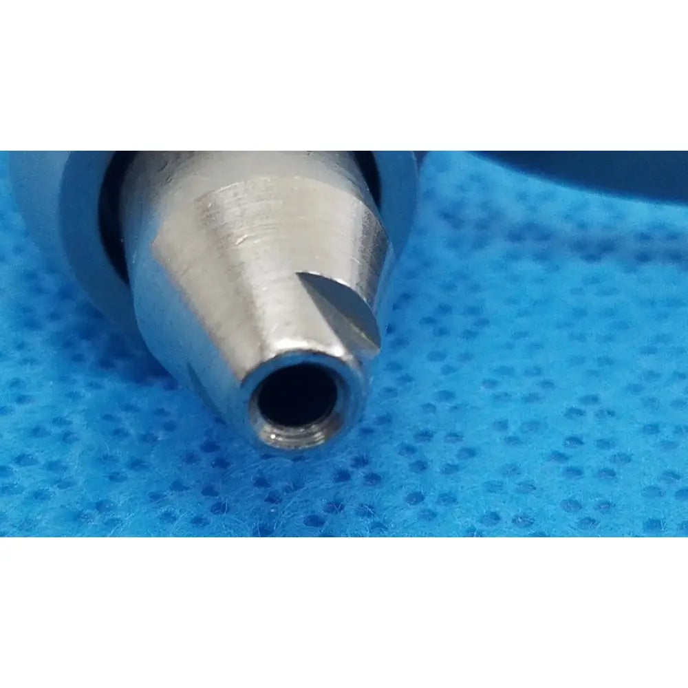 Silver-colored metal stryker wire collet 4100-062-000 with tapered cutting edges for reuse medical applications