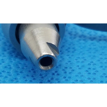 Silver-colored metal stryker wire collet 4100-062-000 with tapered cutting edges for reuse medical applications