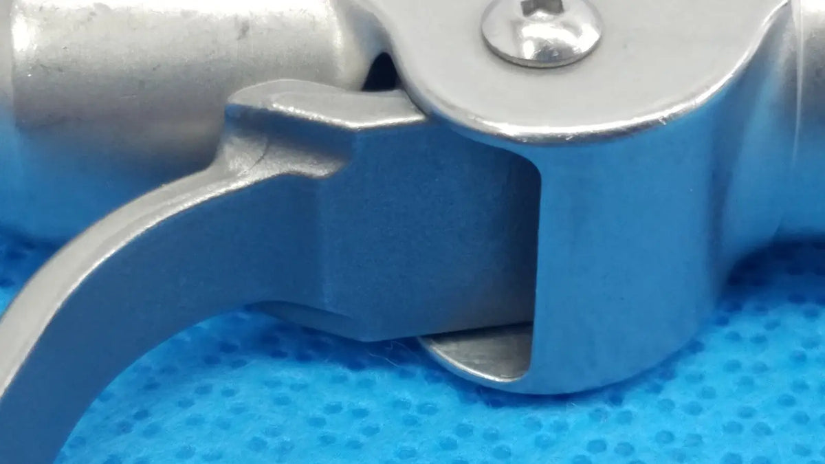 Silver-colored metal trigger with polished finish and ergonomic design for stryker wire collet 4100-062-000 wire collet