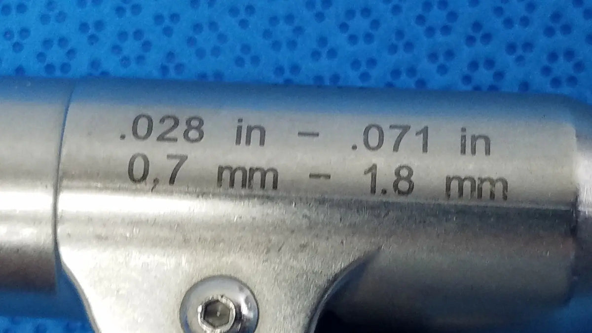 Silver metallic stryker wire collet 4100-062-000 with engraved measurement markings from 0.7 mm to 1.8 mm