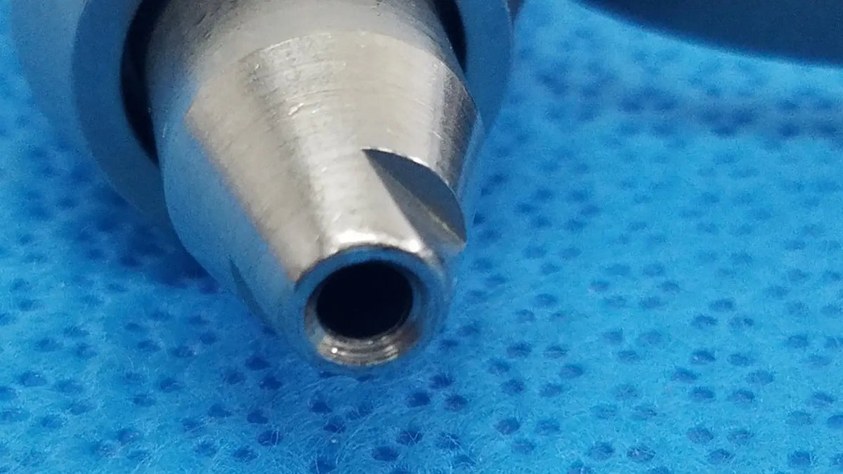 Silver-colored metal stryker wire collet 4100-062-000 with tapered cutting edges for reuse medical applications