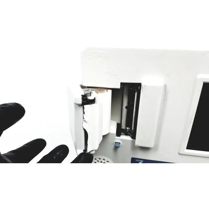 White plastic summiit doppller vista abi medical device showing internal mechanism with partially open reuse medical compartment