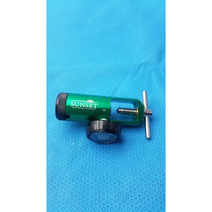 Green metallic sunset brass integral 50 psi medical oxygen regulator with black knobs and silver adjustment handle