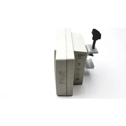 Beige plastic suntech medical tango+ patient monitor with black handle and metallic clamp for medical use