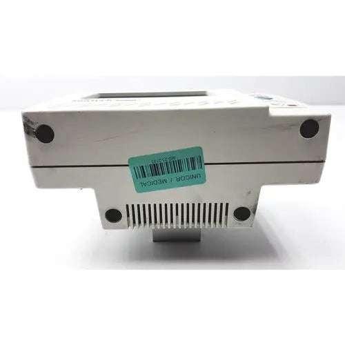 White plastic suntech medical tango+ patient monitor with digital display and ventilation slits for medical use
