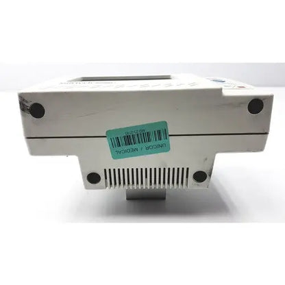 White plastic suntech medical tango+ patient monitor with digital display and ventilation slits for medical use