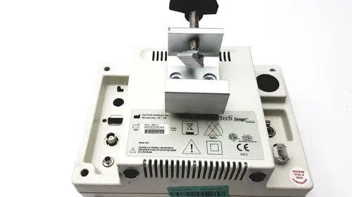 White plastic industrial device with metallic clamp and black knob on suntech medical tango+ patient monitor