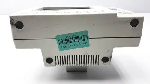 White plastic suntech medical tango+ patient monitor with digital display and ventilation slits for medical use