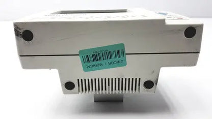 White plastic suntech medical tango+ patient monitor with digital display and ventilation slits for medical use