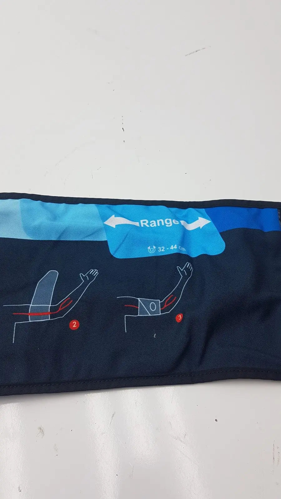 Dark blue fabric suntech orbit abpm cuff size 3 range 32-44 cm with light blue label and arm positioning diagrams