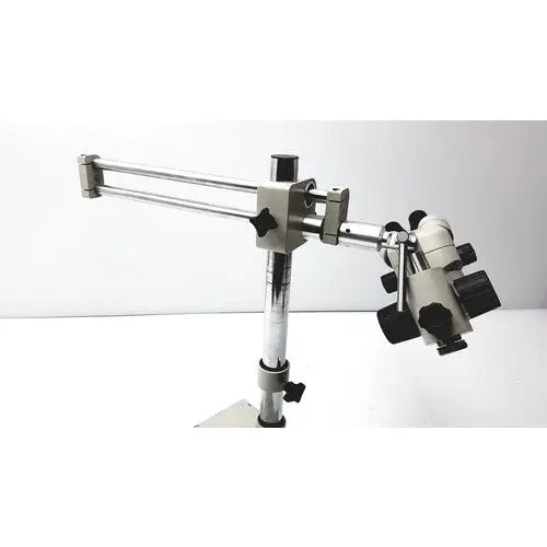 Silver and black metal super widefield microscope with adjustable arm featuring eyepieces 23mm swh10x focus knobs