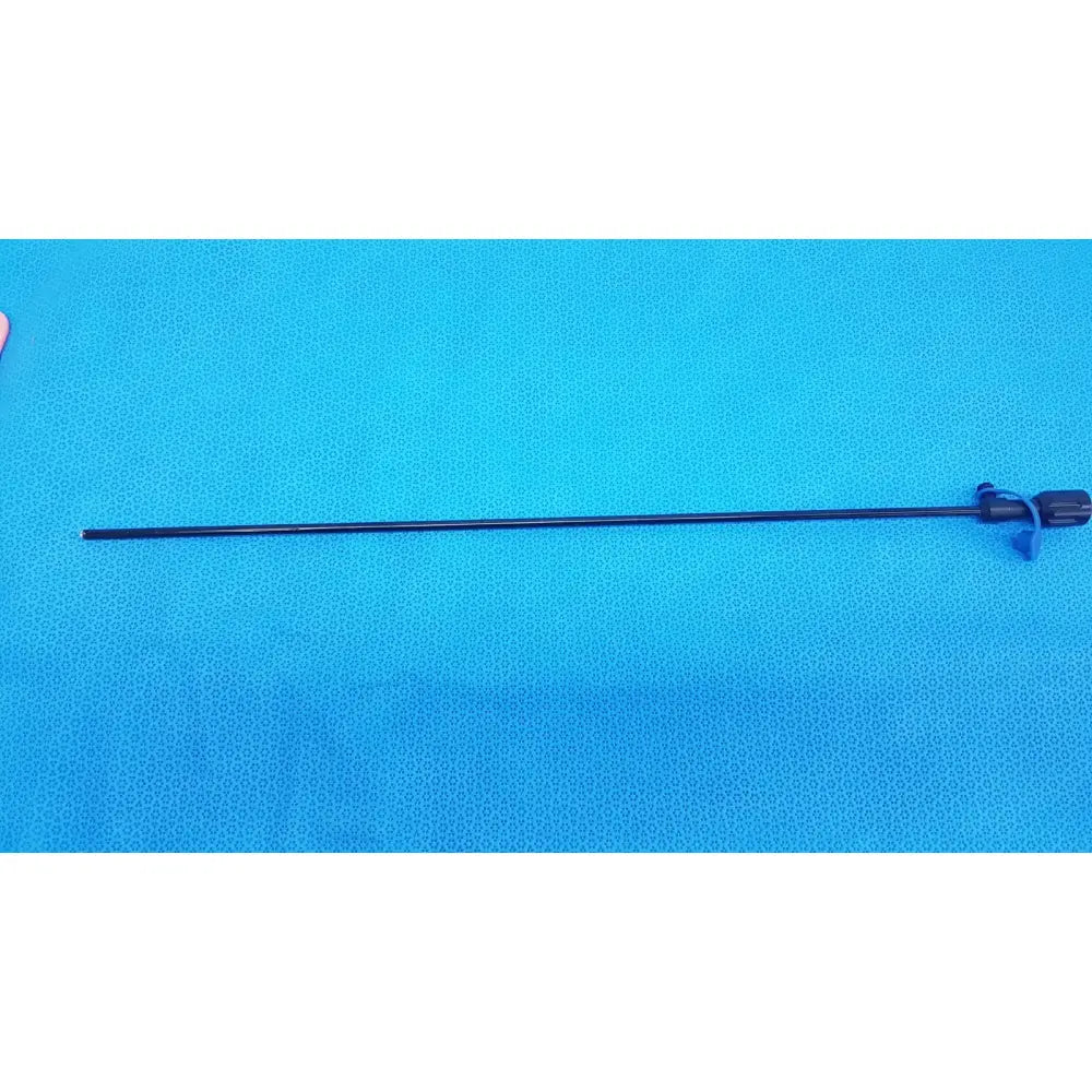 Black surgical cannula sheath with slender rigid shaft and textured handle featuring blue plastic luer lock components