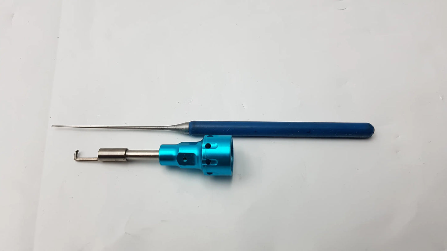 Blue-handled surgical dental instrument with metallic needle probe and turquoise cylindrical head compatible dental instrument