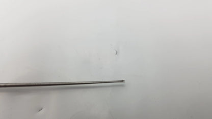 Slender metallic needle probe with pointed tip and tapered shaft in blue handle compatible dental instrument tool