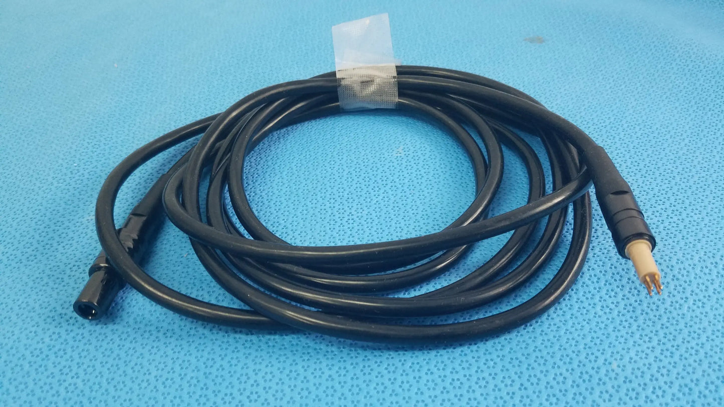 Black coiled surgical scher handpiece cable console power cord with black and beige connectors for medical equipment reuse