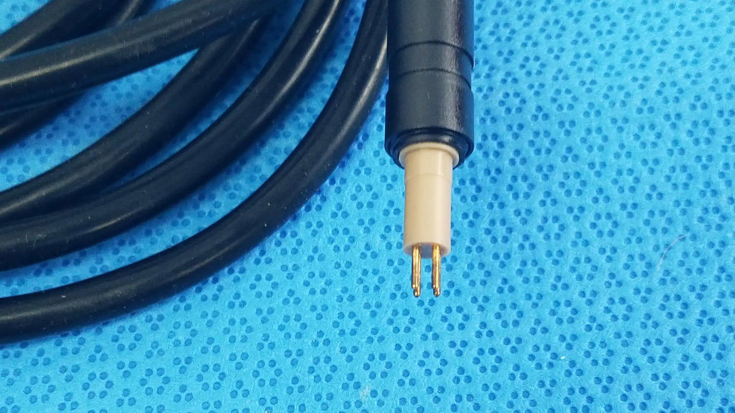 Black coiled surgical scher handpiece cable console connector power cord with beige gold-plated connector for medical equipment