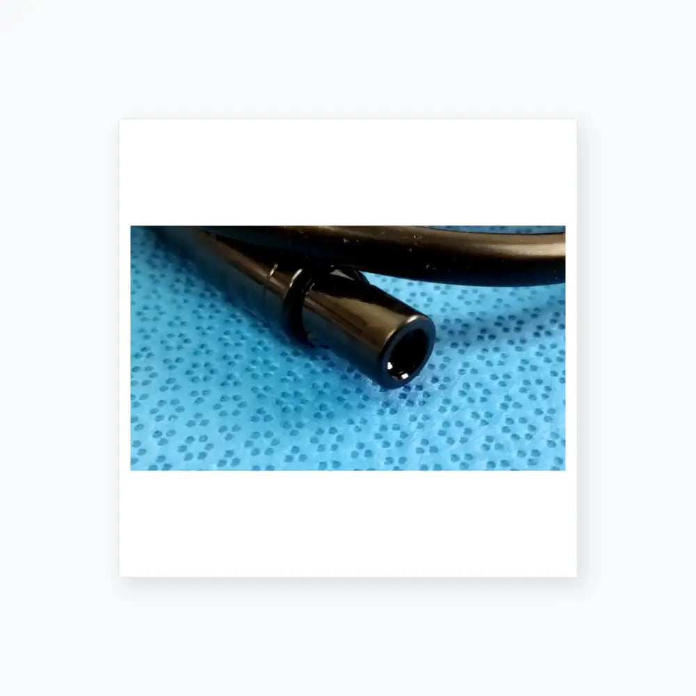 Black plastic cylindrical connector with a glossy finish for surgical scher handpiece cable console in medical equipment