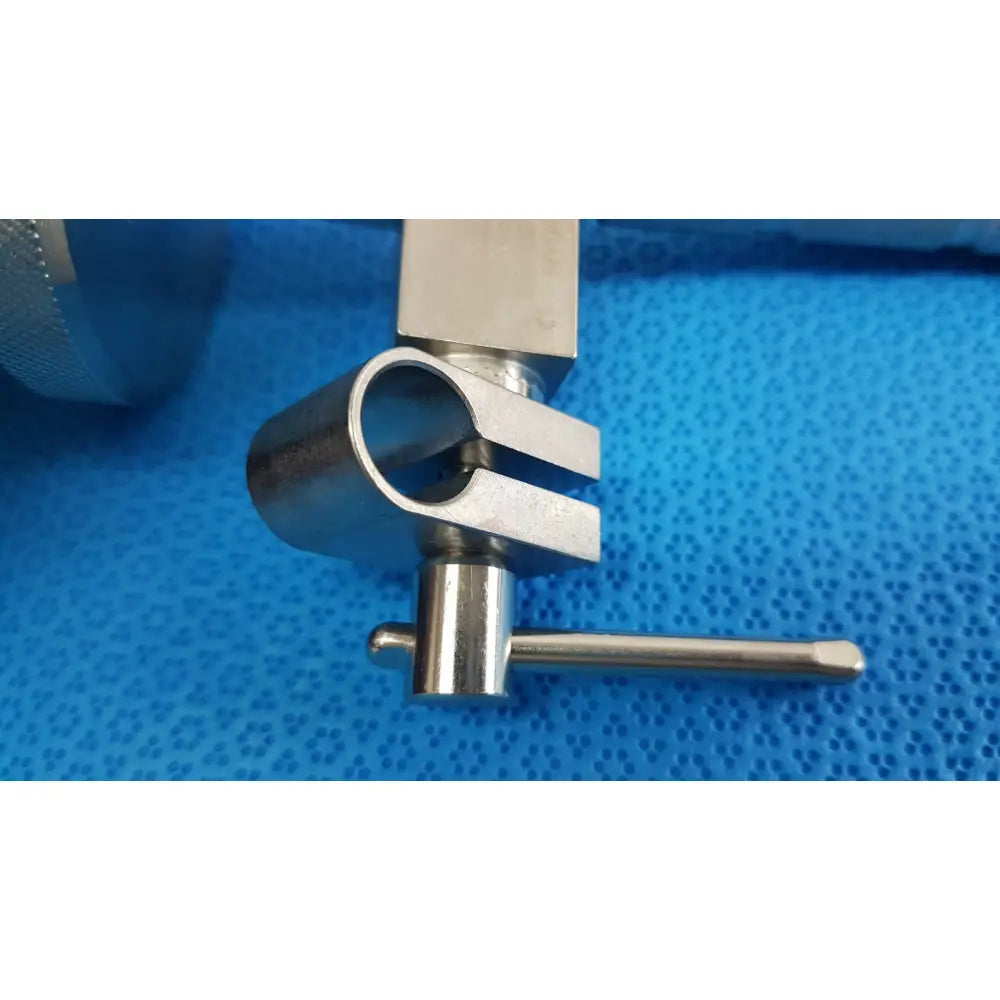 Stainless steel surgical snake flexarm clamp with cylindrical body, flat arms, and threaded adjustment knob for OR use