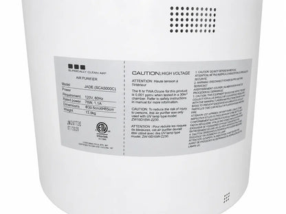 White cylindrical sca5000c surgically clean air purifier with label displaying specifications and safety warnings on back side