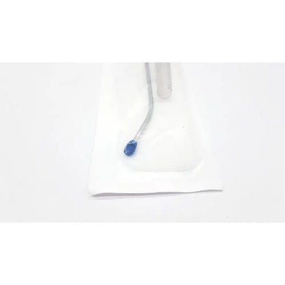 A clear plastic medical catheter with blue tip in sterile white foil packaging from surgimark via-guard suction set smk