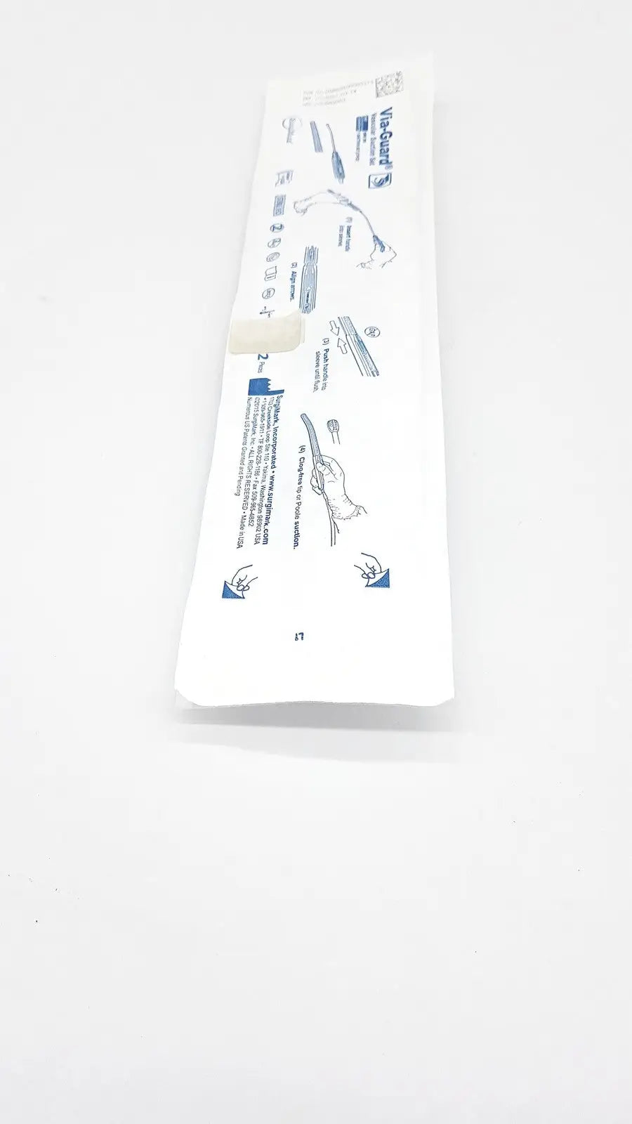 White plastic-wrapped sterile vac-guard catheter kit with blue printed instructions in surgimark via-guard suction set smk box